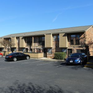 Autumn Chase Apartments in San Marcos, Texas, features buildings with ample parking and a well-maintained exterior.